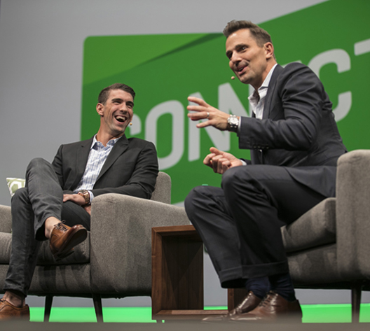 Michael Phelps and Bill Rancic onstage at Intuit conference